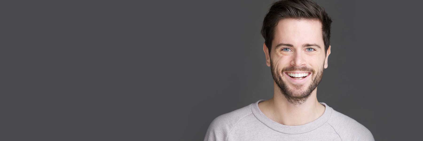 Person Smiling at the camera after recieving painless sedation dentistry