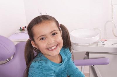 A little girl, happy after receiving top quality pediatric dentistry. 
