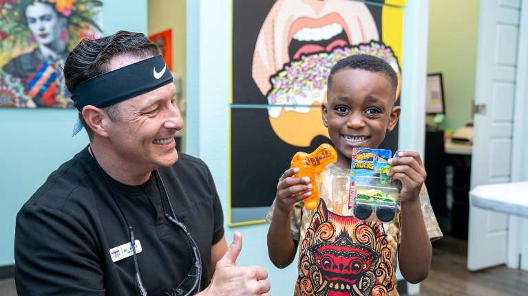 Children's Dentist in Fort Worth Meeting with a Young Boy for his dental appointment