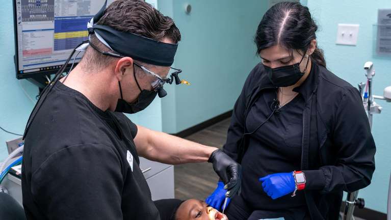 Children's sedation dentist about to perform conscious sedation dentistry on a child