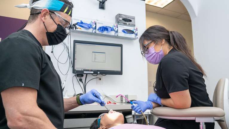 a Fort Worth Pediatric Dentist is performing a routine Special Needs Exam on a patient 