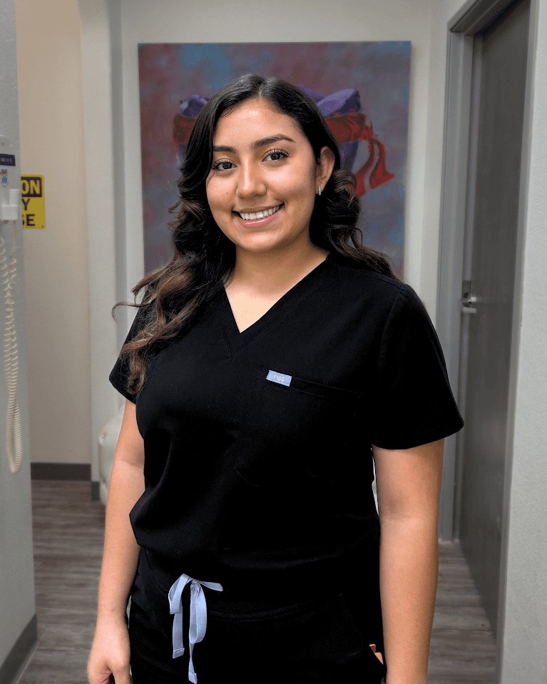 Dental assistant woman in black scrubs at a sedation dentist office in Fort Worth